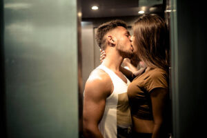 A man kissing a woman