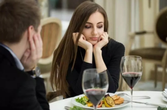 A man with a woman on a first dinner date